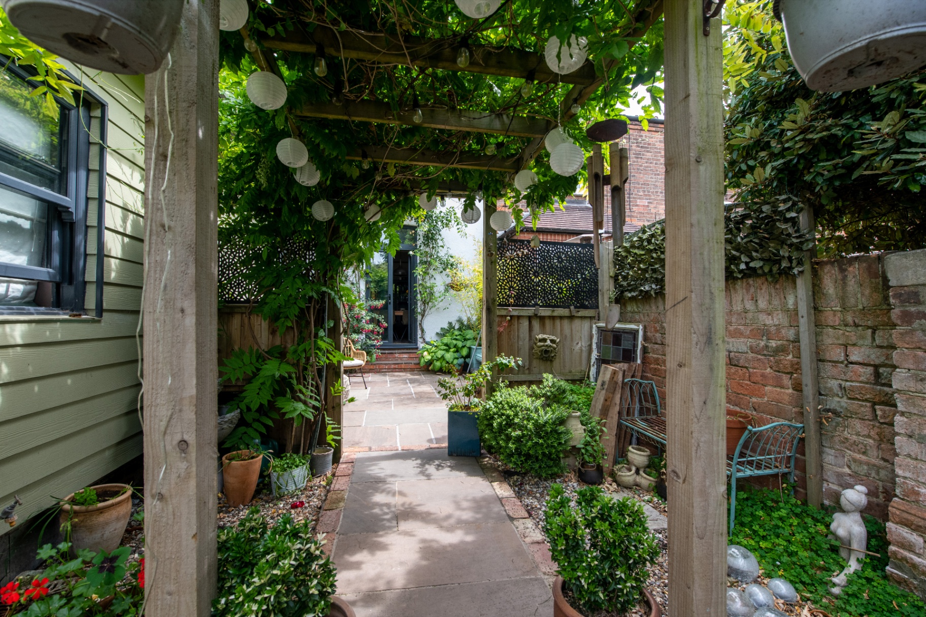 Wisteria pergola over the walkway