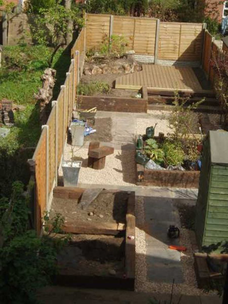 Terraced garden transformation with new fencing, decking and gravel paths on a sloping Midlands plot